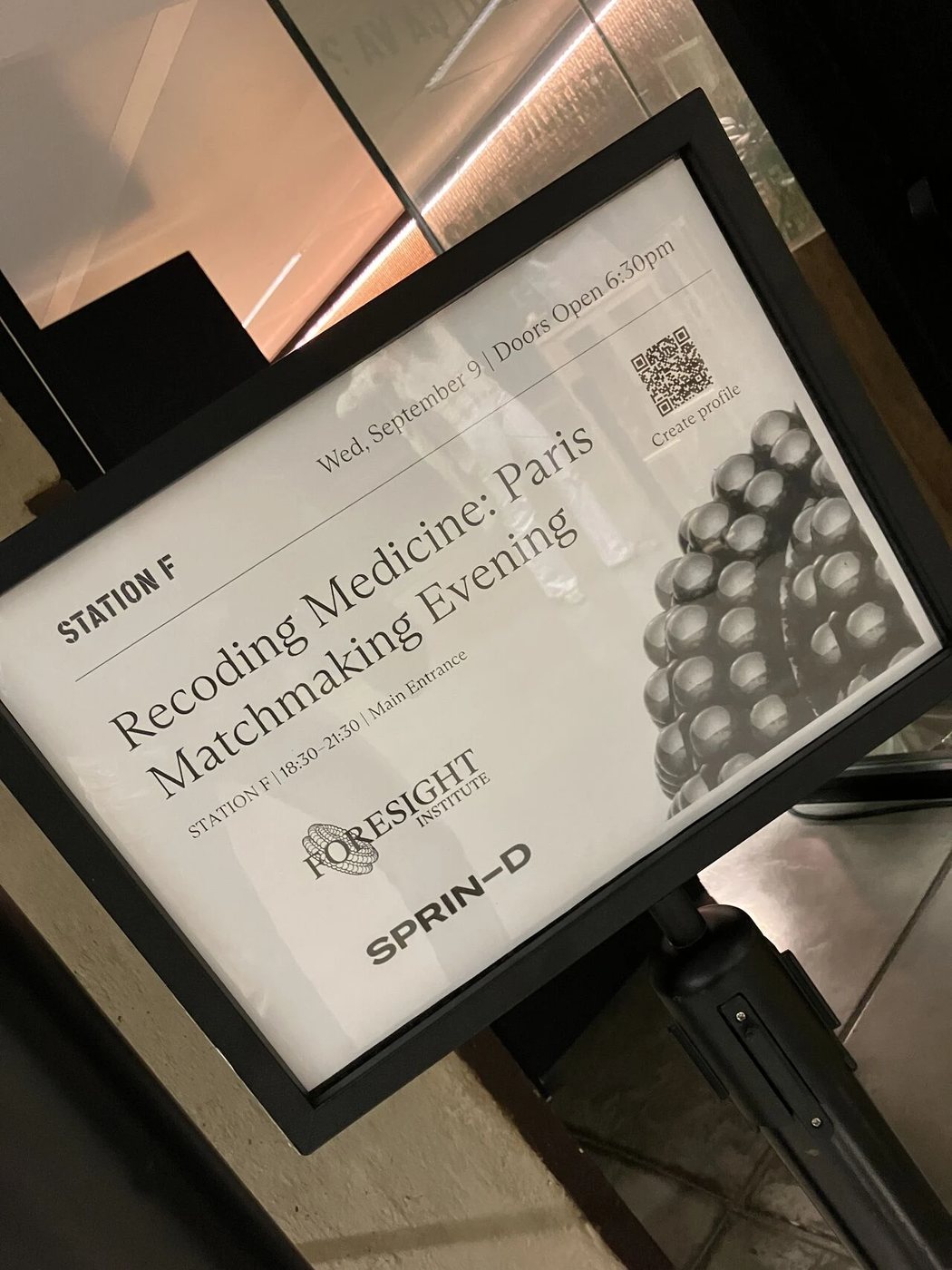 An event sign at Station F reading 'Recoding Medicine: Paris Matchmaking Evening', with the Foresight Institute and SPRIND logos.